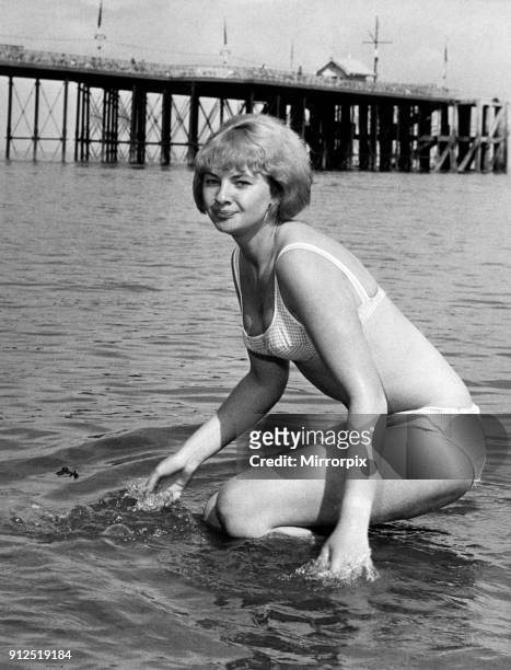 Mandy Rice-Davies, who is in South Wales in the Cabaret, pictured in the sea at Penarth, Vale of Glamorgan, Wales. Circa 1965. .