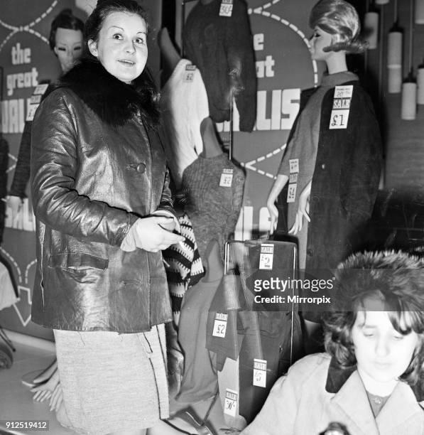 Student Joyce Wells from Salford pictured at the front of the queue for tomorrow's sale at a shop in Manchester with the coat she wants in the...
