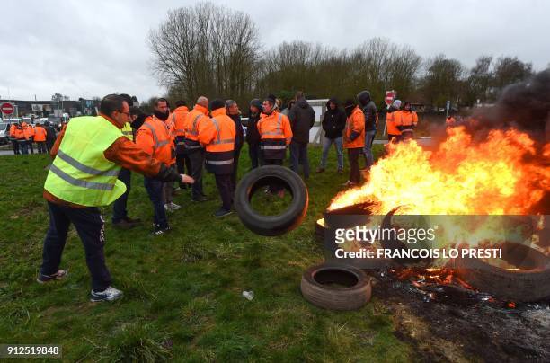 Workers of the Ascoval steel factory of Saint-Saulve, a branch of conglomerate Ascometal and Vallorec, burn tires as they stage a protest by the A2...
