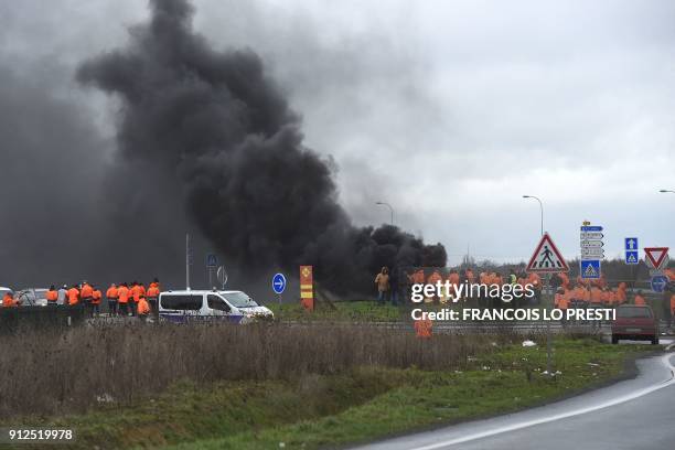 Workers of the Ascoval steel factory of Saint-Saulve, a branch of conglomerate Ascometal and Vallorec, burn tires as they stage a protest by the A2...