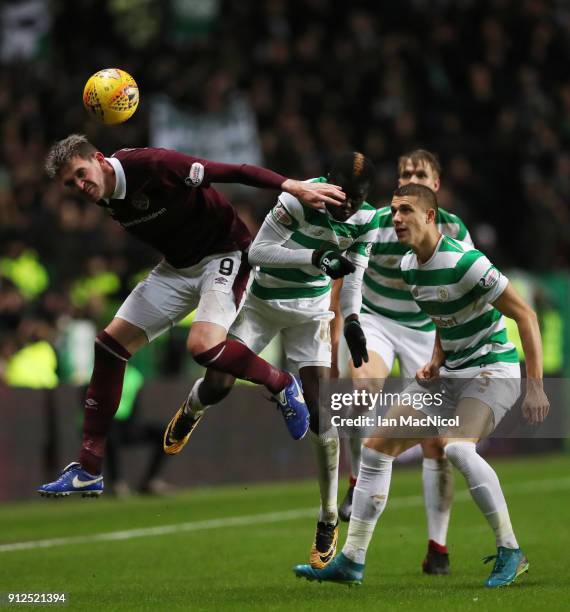 Kyle Lafferty of Heart of Midlothian wins a header during the Scottish Premier League match between Celtic and Heart of Midlothian at Celtic Park on...