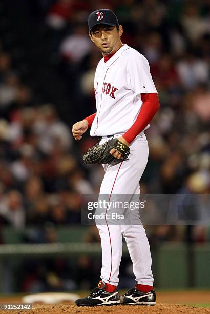 Takashi Saito of the Boston Red Sox reacts after he gave up a solo home run to Adam Lind of the Toronto Blue Jays in the seventh inning on September...