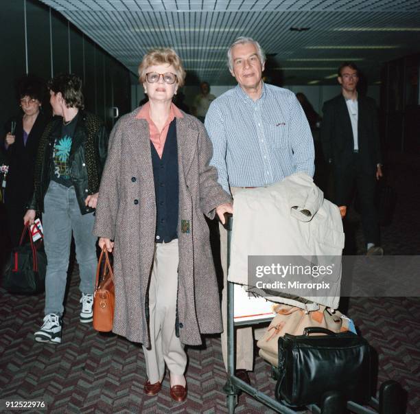 Angela Lansbury and husband Peter Shaw at London Airport, 13th March 1990.