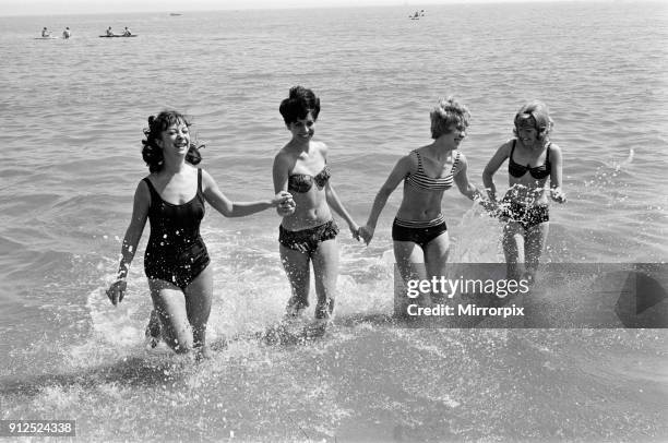 Holiday scenes in Brighton, East Sussex on the Whitsun bank holiday, 15th May 1964.