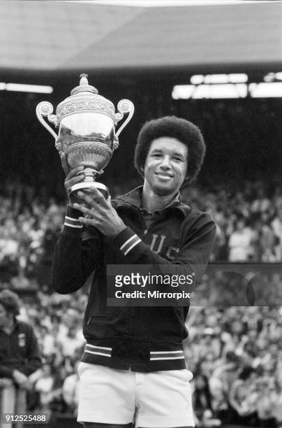 Arthur Ashe with the Wimbledon trophy after he beat the defending champion Jimmy Connors in four sets, 6-1, 6-1, 5-7, 6-4 6th July 1975.