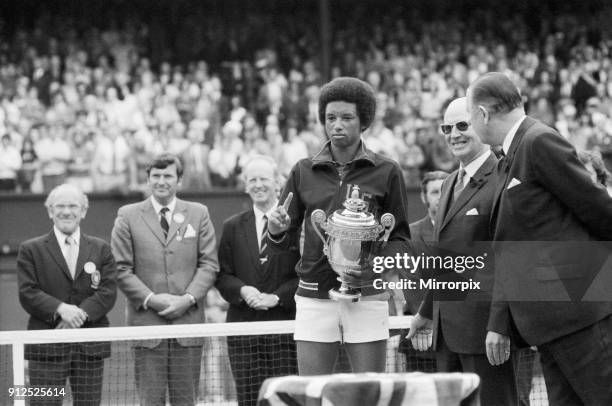 Arthur Ashe with the Wimbledon trophy after he beat the defending champion Jimmy Connors in four sets, 6-1, 6-1, 5-7, 6-4 6th July 1975.