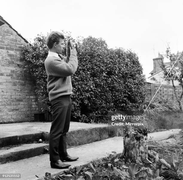 Year old Gordon Faulkner in his garden, holding the camera with which he photographed 'The Thing' UFO flying over Warminster, 9th September 1965.