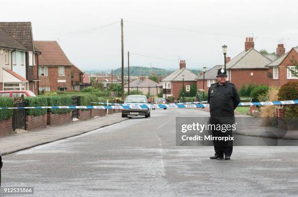 Policeman standing nearby The Coxlodge in Fawdon, Newcastle upon Tyne, where last night Derek Lee was murdered by Steven Cook and John Harvey. Cook...