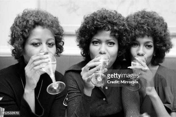 The Supremes, left to right, Cindy Birdsong, Jean Terrell and Mary Wilson, toasting a happy birthday to their lead singer Jean who is celebrating her...