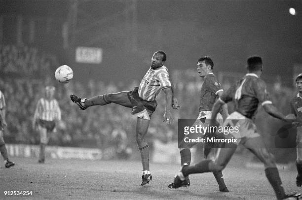 Coventry City 5 v Nottingham Forest 4. Fourth round of the Rumbelows Cup at Highfield Road: Cyrille Regis bring down the ball, 28th November 1990 .