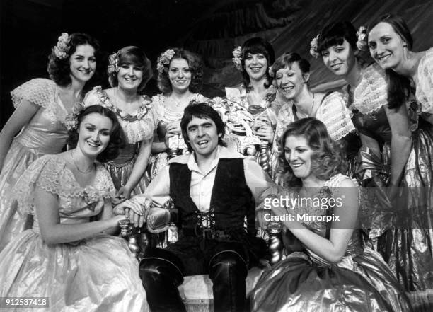 Davy Jones with girls from the show, Jack and the Beanstalk, at the Liverpool Empire. December 1979.