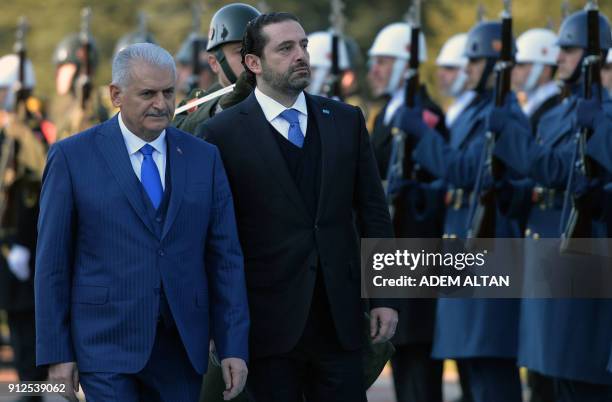 Lebanese Prime Minister Saad Hariri shakes hands with Turkish Prime Minister Binali Yildirim with an official ceremony during his visit at Cankaya...