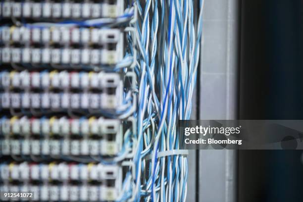 Blue and white cables and insulation displacement contact blocks sit inside a very high bit rate digital subscriber line telecoms cabinet as Royal...