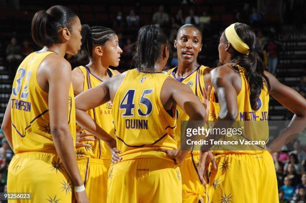 Lisa Leslie of the Los Angeles Sparks talks with teammates Tina Thompson, Candace Parker, Noelle Quinn and DeLisha Milton-Jones in team huddle during...