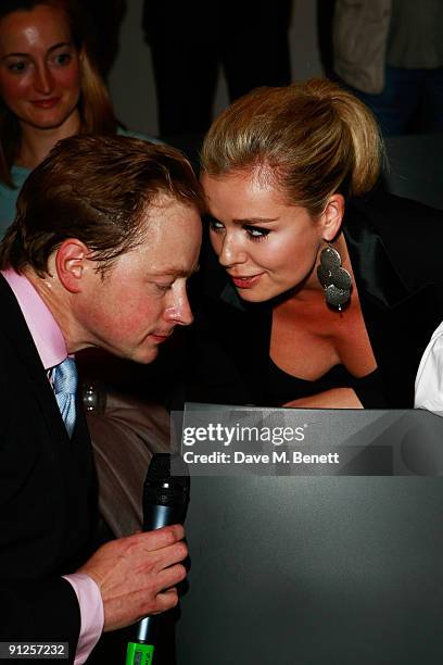 Auctioneer Nick Martineau and Katherine Jenkins attend the Macmillan De'Longhi Art Auction 2009 at The Avenue on September 29, 2009 in London,...