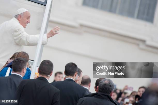 Pope Francis greets faithful as he arrives for his weekly general audience in St. Peter`s Square,Vatican City,Vatican, 31 January 2018.