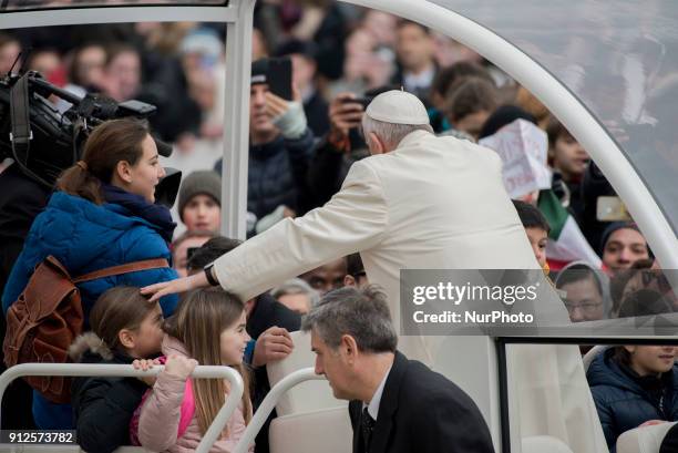 Pope Francis greets childs as he arrives for his weekly general audience in St. Peter`s Square,Vatican City,Vatican, 31 January 2018.