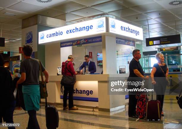 Tourists at a money exchange counter at Reina Sofia Airport Tenerife on January 19, 2018 in El Medano, Tenerife, Spain.