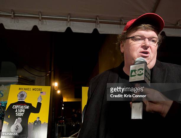 Director Michael Moore speaks with reporters on the red carpet of the Washington DC premiere of "Capitalism: A Love Story" at AMC Uptown Theater on...