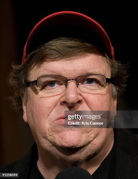 Director Michael Moore speaks with reporters on the red carpet of the Washington DC premiere of "Capitalism: A Love Story" at AMC Uptown Theater on...