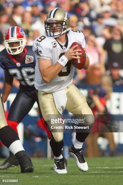 Quarterback Drew Brees of the New Orleans Saints moves to pass the ball during the game against the Buffalo Bills at Ralph Wilson Stadium on...