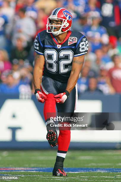 Josh Reed of the Buffalo Bills adjust his socks during the game against the New Orleans Saints at Ralph Wilson Stadium on September 27, 2009 in...