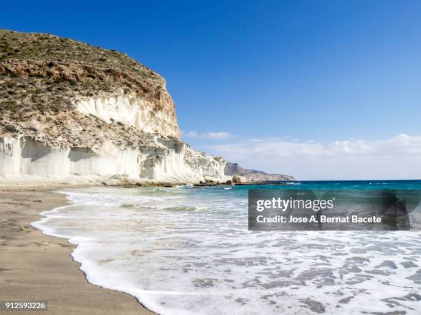 rocky coast of the cabo de gata with formations of volcanic rock of white color.  cabo de gata - nijar natural park, cala del plomo, beach, biosphere reserve, almeria,  andalusia, spain - cabo de gata fotografías e imágenes de stock