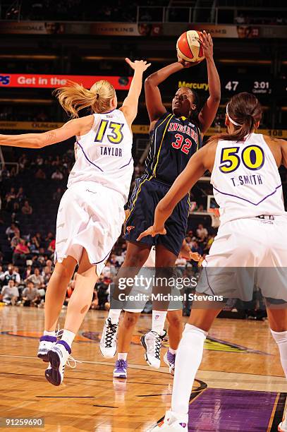 Ebony Hoffman of the Indian Fever puts a shot up over Penny Taylor of the Phoenix Mercury in Game one of the WNBA Finals played on September 29, 2009...