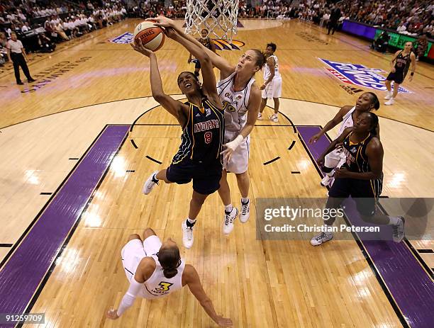 Tammy Sutton-Brown of the Indiana Fever has he shot bloced by Nicole Ohlde of the Phoenix Mercury in Game One of the 2009 WNBA Finals at US Airways...