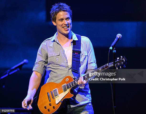 Musician Jonny Lang performs onstage during the Rock A Little, Feed Alot benefit concert held at Club Nokia on September 29, 2009 in Los Angeles,...