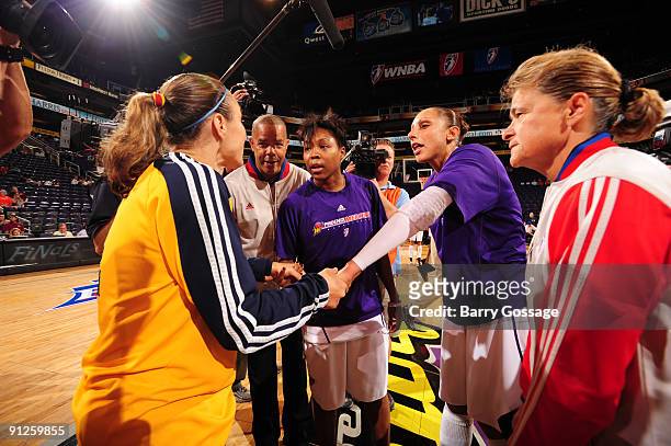 Cappie Pondexter and Diana Taurasi of the Phoenix Mercury greet Tully Bevilaqua of the Indiana Fever in Game one of the WNBA Finals played on...