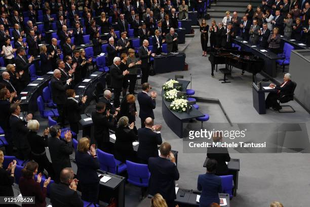Members of Parliament give a standing ovation to Auschwitz survivor Anita Lasker-Wallfisch who spoke during the commemoration ceremony of the...