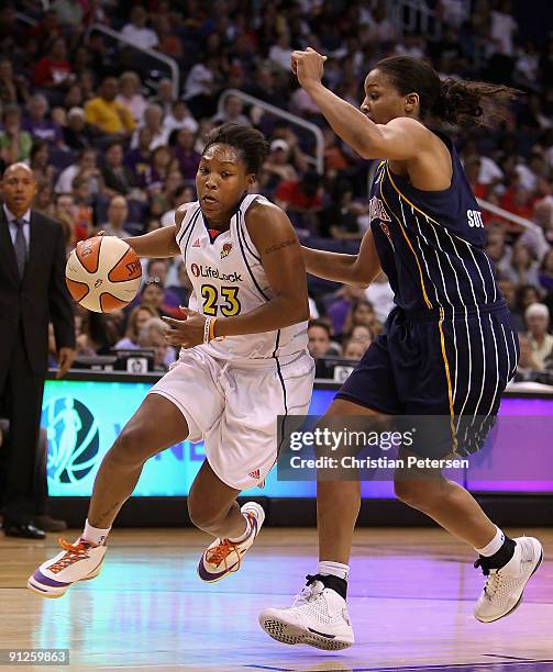 Cappie Pondexter of the Phoenix Mercury drives the ball past Tammy Sutton-Brown of the Indiana Fever in Game One of the 2009 WNBA Finals at US...