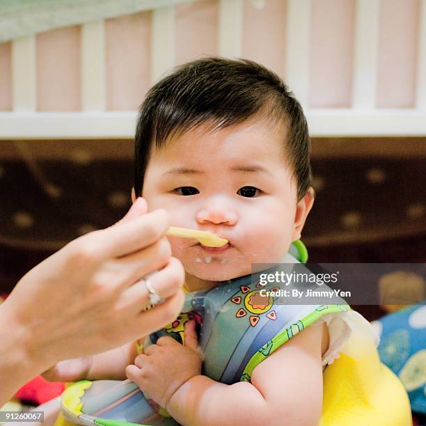 Baby Eating High-Res Stock Photo