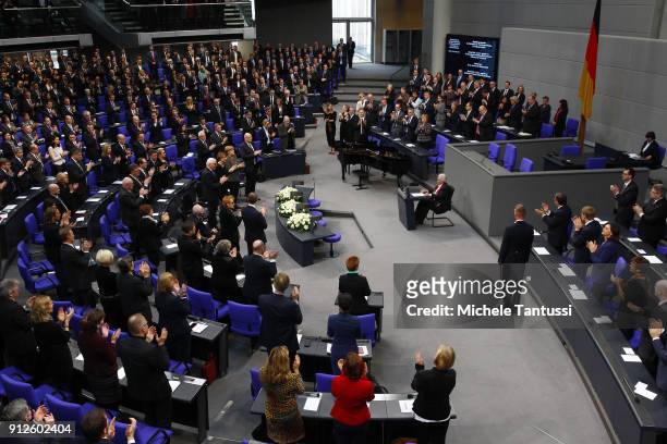 Members of Parliament give a standing ovation to Auschwitz survivor Anita Lasker-Wallfisch who spoke during the commemoration ceremony of the...