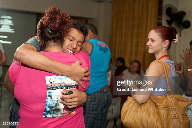 Irlan Santos da Silva, main character of the film "Only When I Dance", hugs his mother after the movie's premiere at the Complexo do Alemao Shanty...