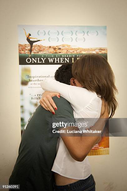Irlan Santos da Silva , main character of the film "Only When I Dance", hugs its director Beadie Finzi during the movie's premiere at the Complexo do...