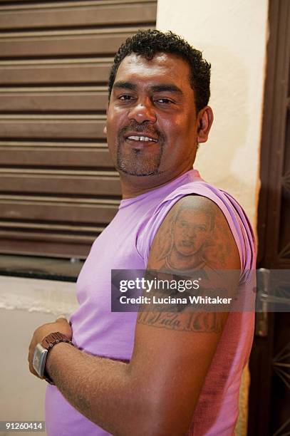 Irlan Santos da Silva's father shows the image of his son tattooed on his arm, with the writtens of "My son, my life", during the premiere of the...