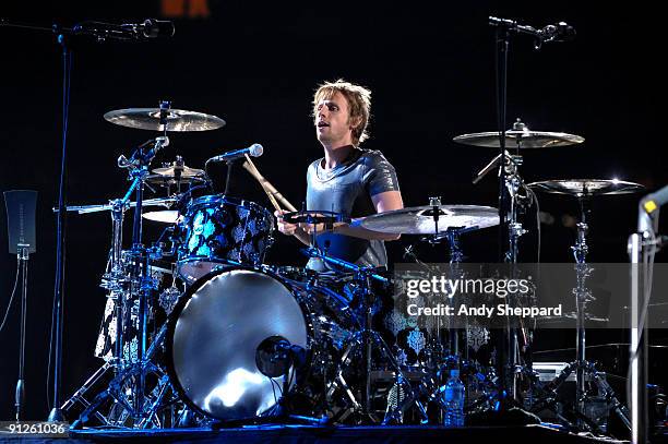 Dominic Howard of Muse performs on stage at FedExField on September 29, 2009 in Landover, Maryland.