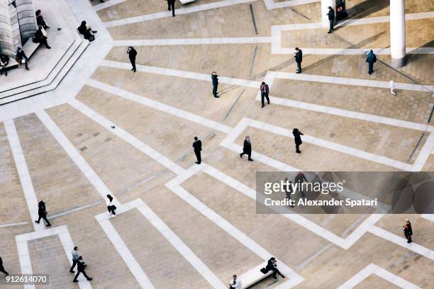 high angle view of pedestrians at paternoster square, london, uk - british culture walking stock pictures, royalty-free photos & images