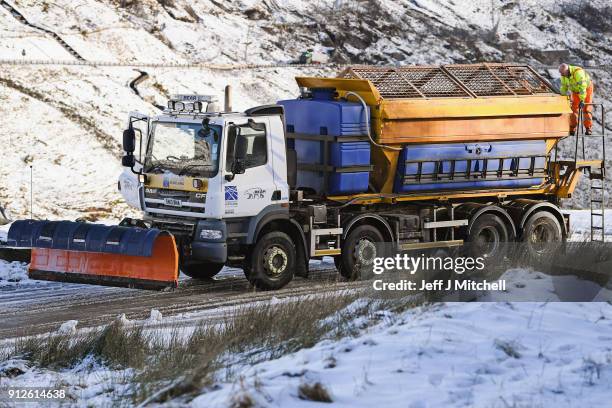 Snow plough spreads grit on the A83 Rest and Be Thankful as wintery conditions return on January 31, 2018 in Arrochar, Scotland. Motorists were...