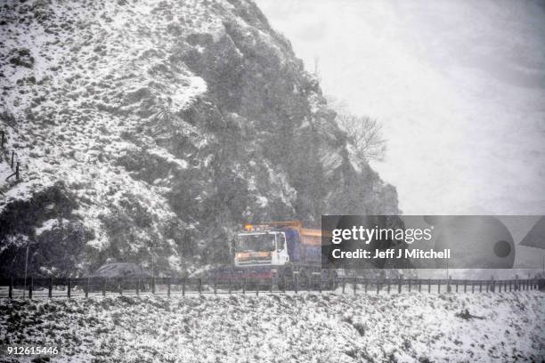 Snow plough spreads grit on the A83 Rest and Be Thankful as wintery conditions return on January 31, 2018 in Arrochar, Scotland. Motorists were...