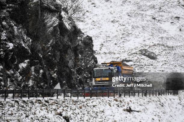 Snow plough spreads grit on the A83 Rest and Be Thankful as wintery conditions return on January 31, 2018 in Arrochar, Scotland. Motorists were...