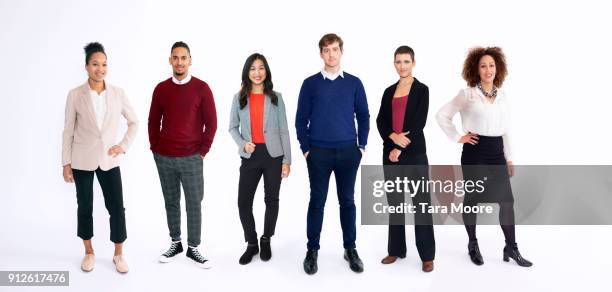 group of business people in studio - gente en fila fotografías e imágenes de stock