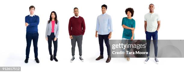 multi ethnic group of young adults - gente en fila fotografías e imágenes de stock