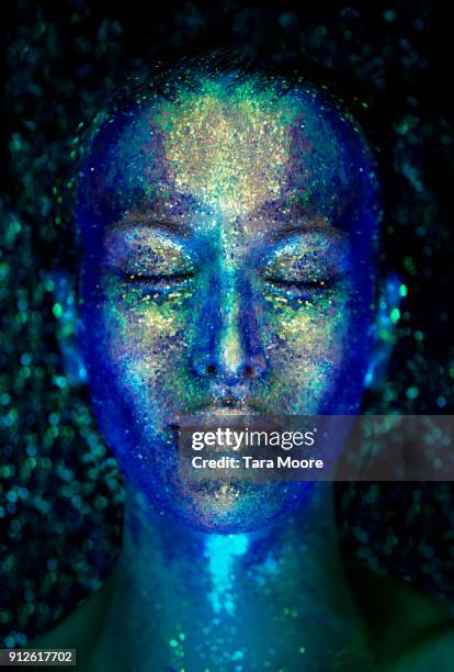 woman's face covered with glitter - body adornment stock pictures, royalty-free photos & images
