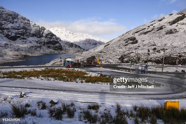 Vehicles park at the top of the A83 Rest and Be Thankful as wintery conditions return on January 31, 2018 in Arrochar, Scotland. Motorists were...