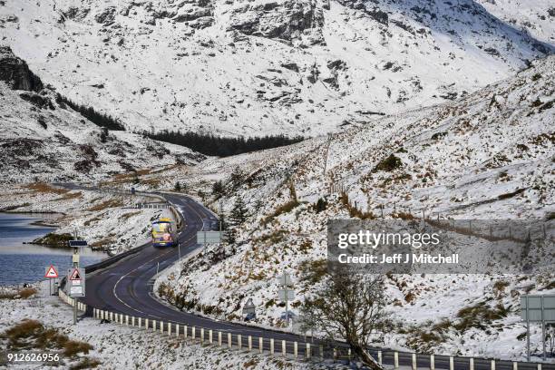 Bus travels along the A83 Rest and Be Thankful as wintery conditions return on January 31, 2018 in Arrochar, Scotland. Motorists were warned to drive...