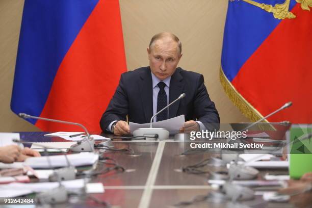 Russian President Vladimir Putin attends his weekly meeting with minister of Russian Government, on January 31, 2018 at Novo-Ogaryovo State...