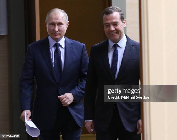 Russian President Vladimir Putin and Prime Minister Dmitry Medvedev enter the hall during his weekly meeting with minister of Russian Government, on...